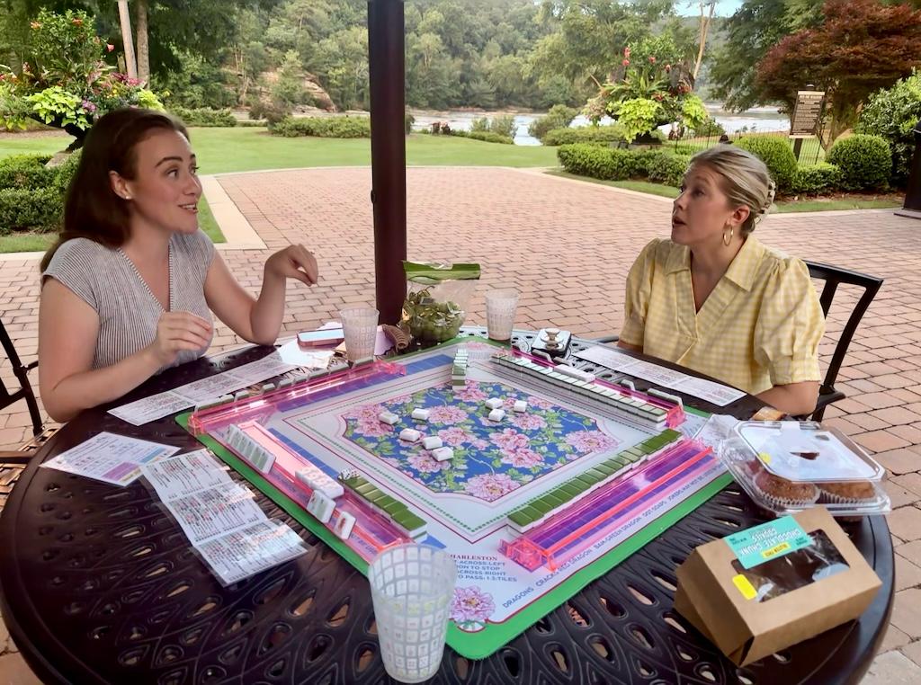 Mahjong lesson materials and tiles arranged for play